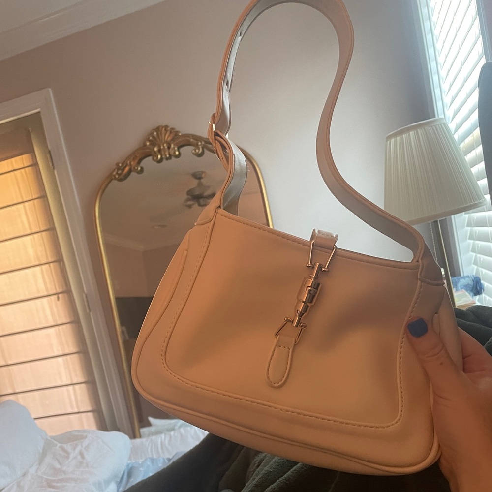 White buckle bag